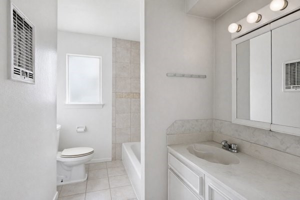 1655 Hawthorne Street Houston, TX 77006 - Photo 34 of 39 a bathroom with a sink a toilet and shower