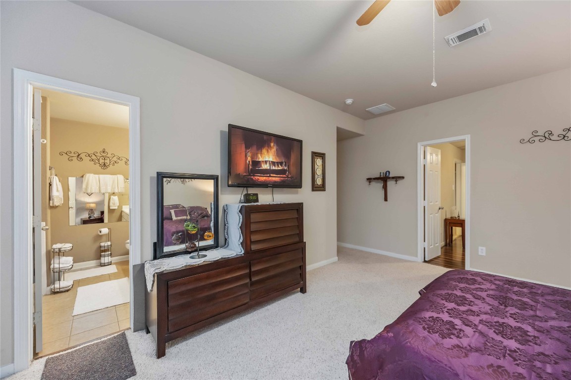 3022 Pathfinders Pass Spring, TX 77373 - Photo 18 of 24 a bedroom with furniture and a flat screen tv