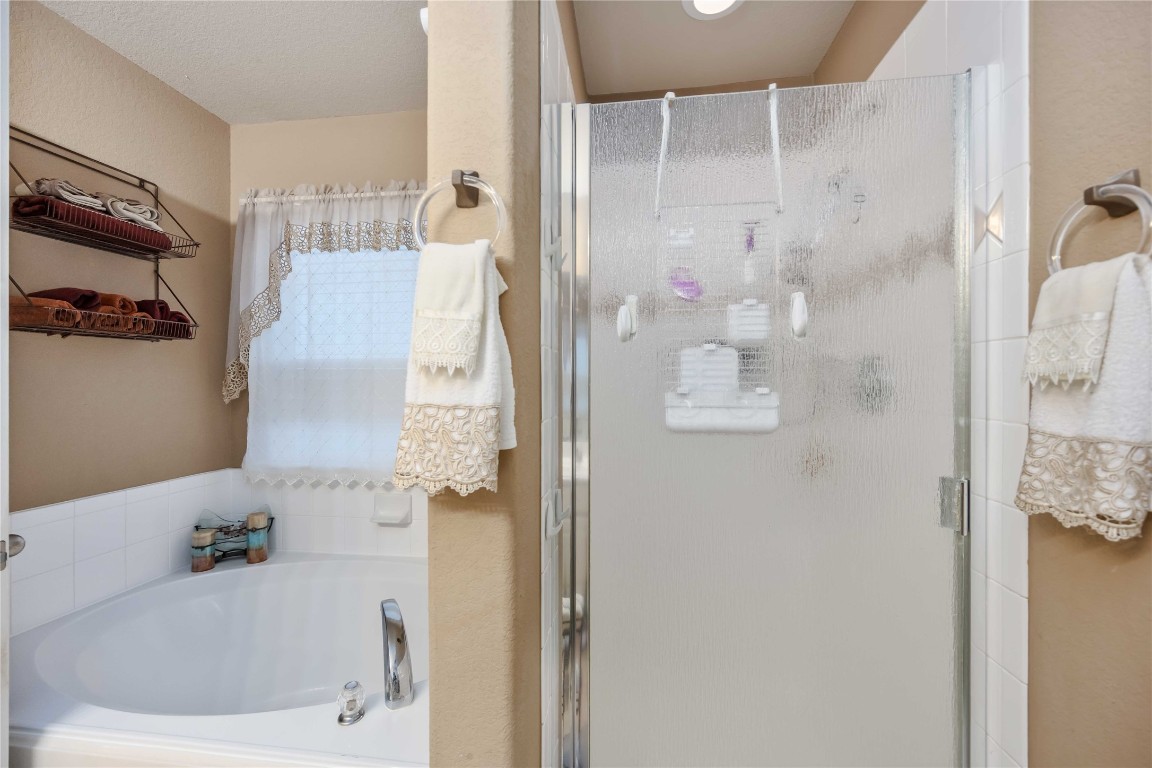 3022 Pathfinders Pass Spring, TX 77373 - Photo 20 of 24 a bathroom with a bathtub and shower