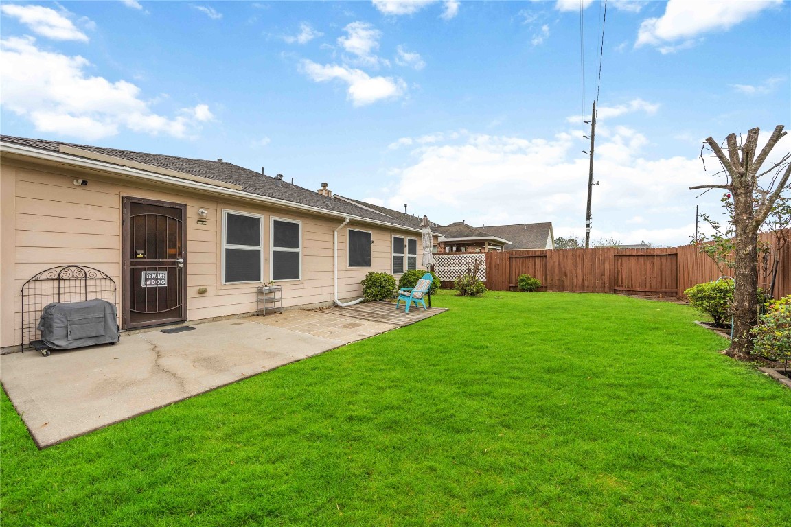 3022 Pathfinders Pass Spring, TX 77373 - Photo 24 of 24 a view of a backyard with a garden and plants