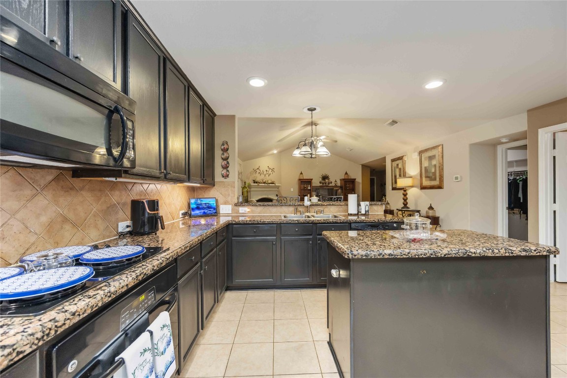 3022 Pathfinders Pass Spring, TX 77373 - Photo 5 of 24 a kitchen with granite countertop stainless steel appliances and sink