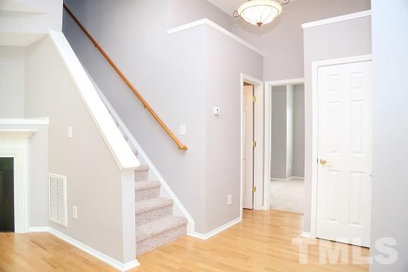 8312 Chimneycap Drive Raleigh, NC 27613 - Photo 12 of 25 a view of entryway with wooden floor