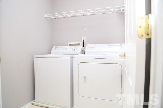 8312 Chimneycap Drive Raleigh, NC 27613 - Photo 15 of 25 a utility room with dryer and washer