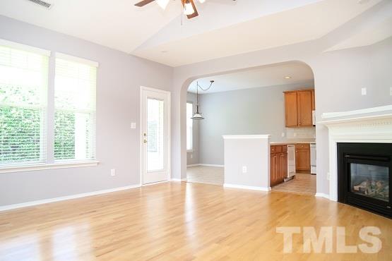 8312 Chimneycap Drive Raleigh, NC 27613 - Photo 6 of 25 a view of a livingroom with a fireplace and window