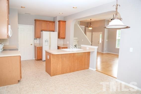 8312 Chimneycap Drive Raleigh, NC 27613 - Photo 7 of 25 a view of kitchen with furniture and a window