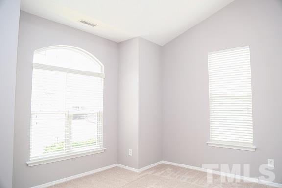 8312 Chimneycap Drive Raleigh, NC 27613 - Photo 10 of 25 a view of a room that has a window in it
