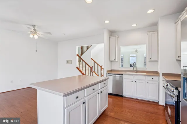 a kitchen with sink cabinets and appliances