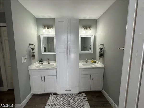 a bathroom with a sink and a mirror