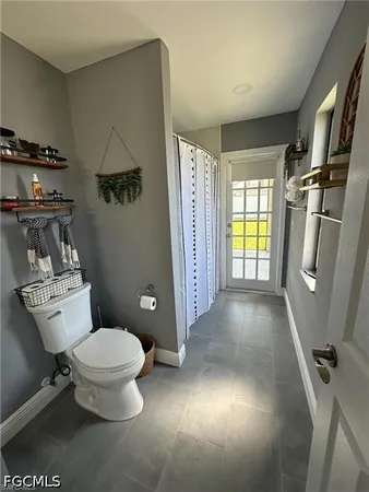 a view of bathroom with a toilet and a shower