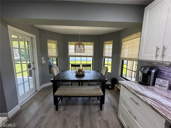 a living room with furniture rug and window