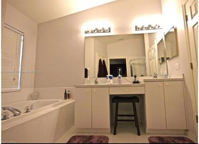a bathroom with a sink and a bathtub