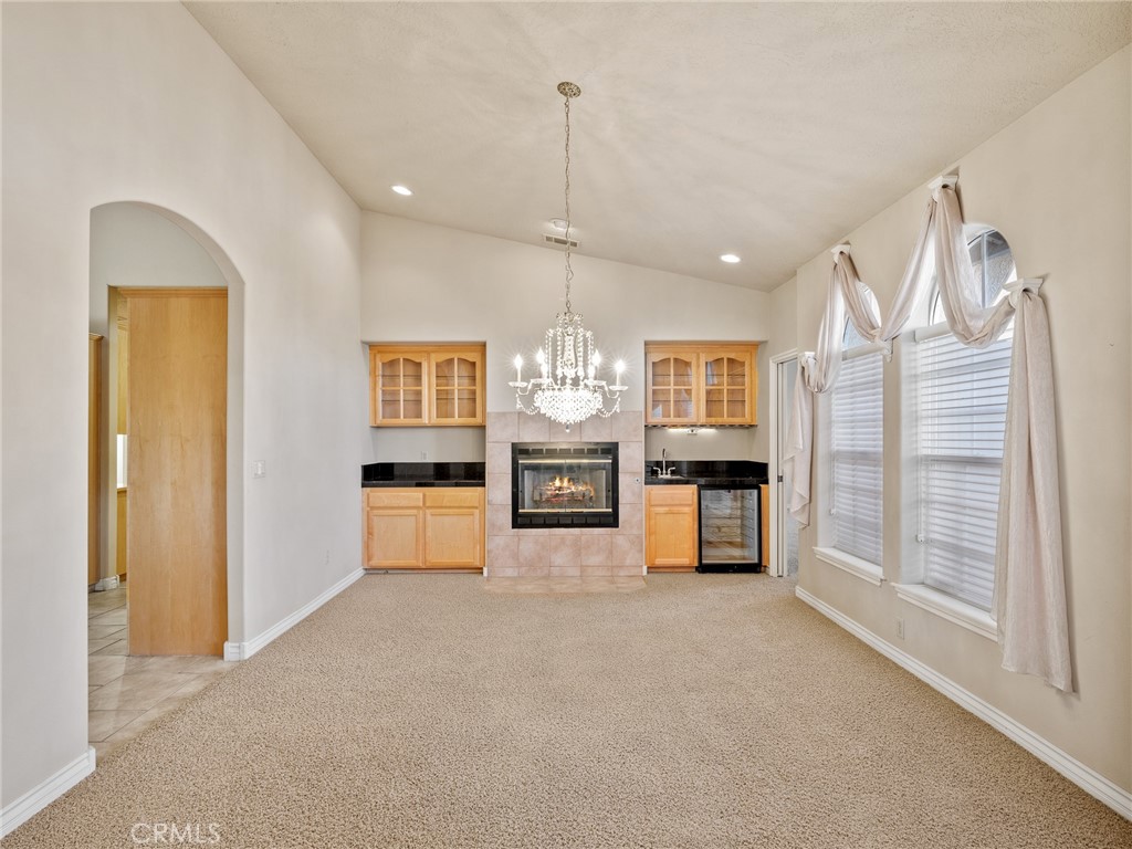 11385 Oak Ridge Drive Oak Hills, CA 92344 - Photo 20 of 69 a living room with furniture and a chandelier
