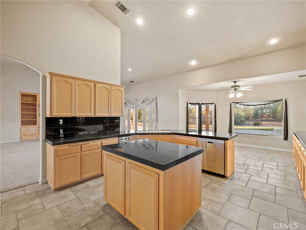 11385 Oak Ridge Drive Oak Hills, CA 92344 - Photo 28 of 69 a kitchen with stainless steel appliances granite countertop a stove a sink a oven and a refrigerator