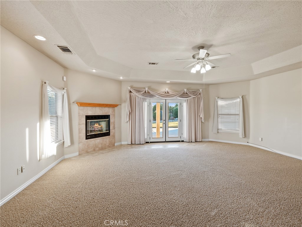 11385 Oak Ridge Drive Oak Hills, CA 92344 - Photo 41 of 69 a view of a livingroom with an empty space and a fireplace