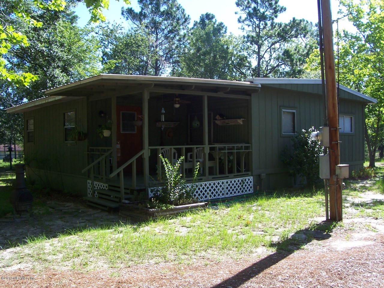 6254 Payne Road Keystone Heights, FL 32656 - Photo 5 of 17 a front view of a house with garden