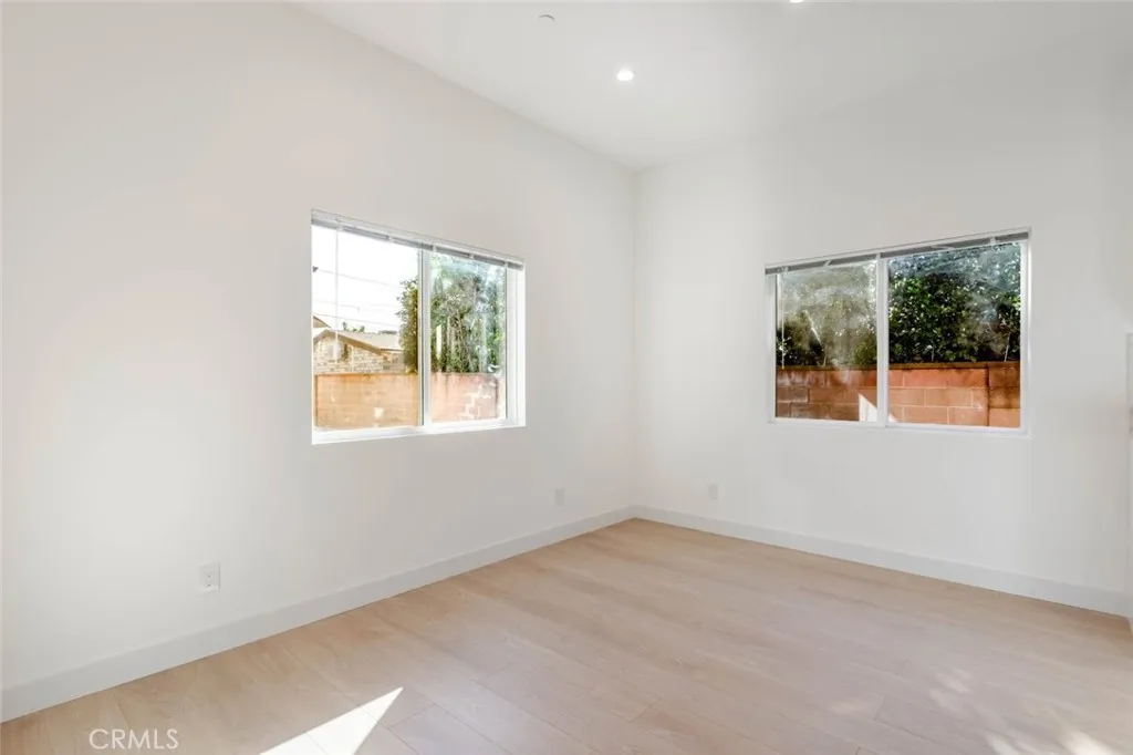 6850 Ranchito Avenue Van Nuys, CA 91405 - Photo 8 of 23 an empty room with windows