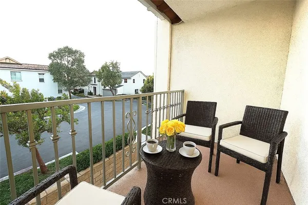a view of a balcony with chairs