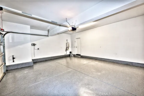 an empty room with a ceiling fan and window
