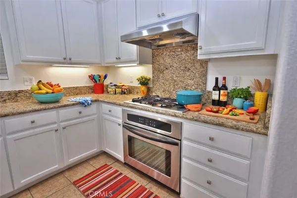 a kitchen with cabinets and appliances