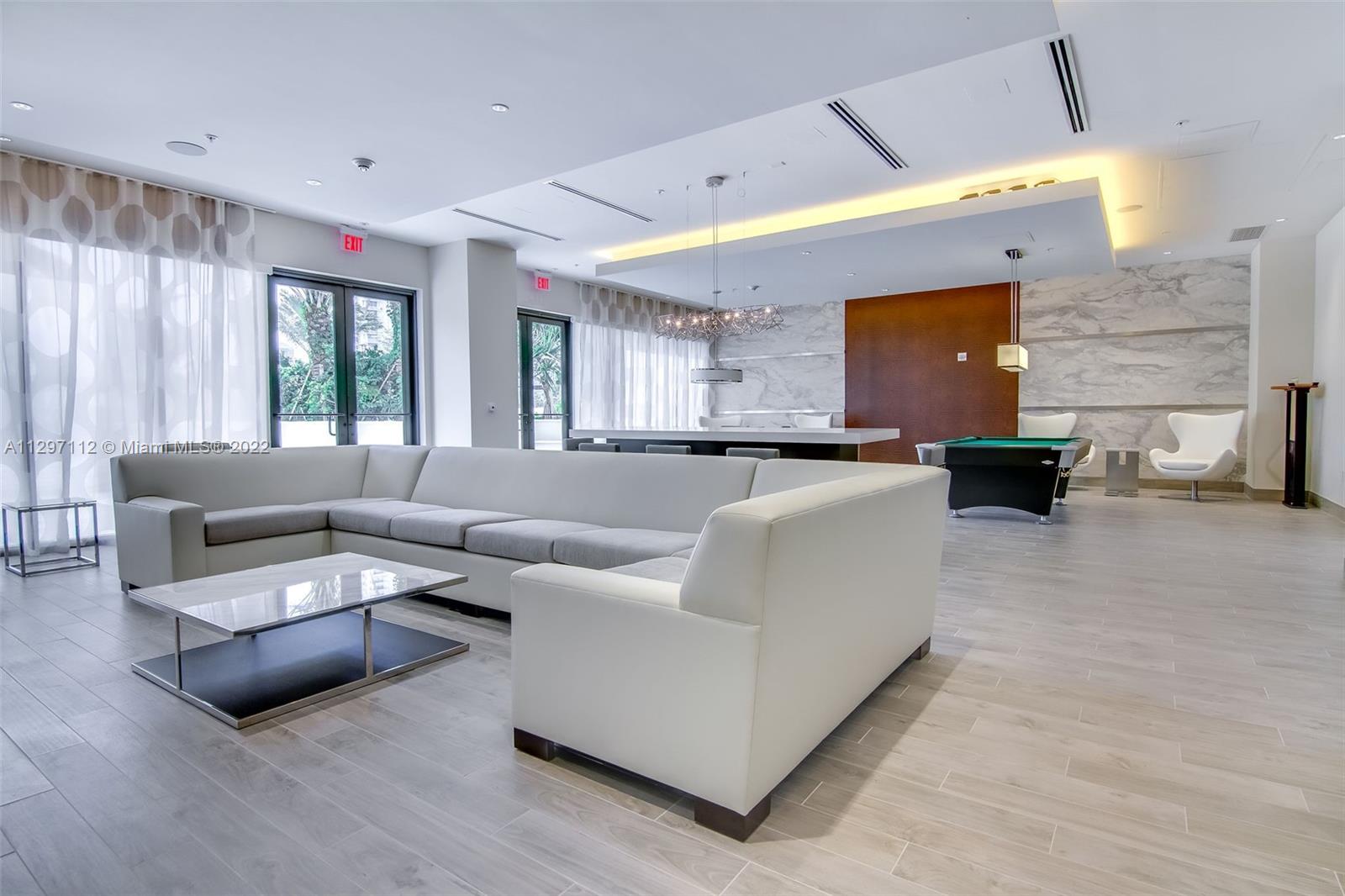 999 Southwest 1st Avenue, Unit 2717 Miami, FL 33130 - Photo 30 of 93 a living room with furniture and a large window