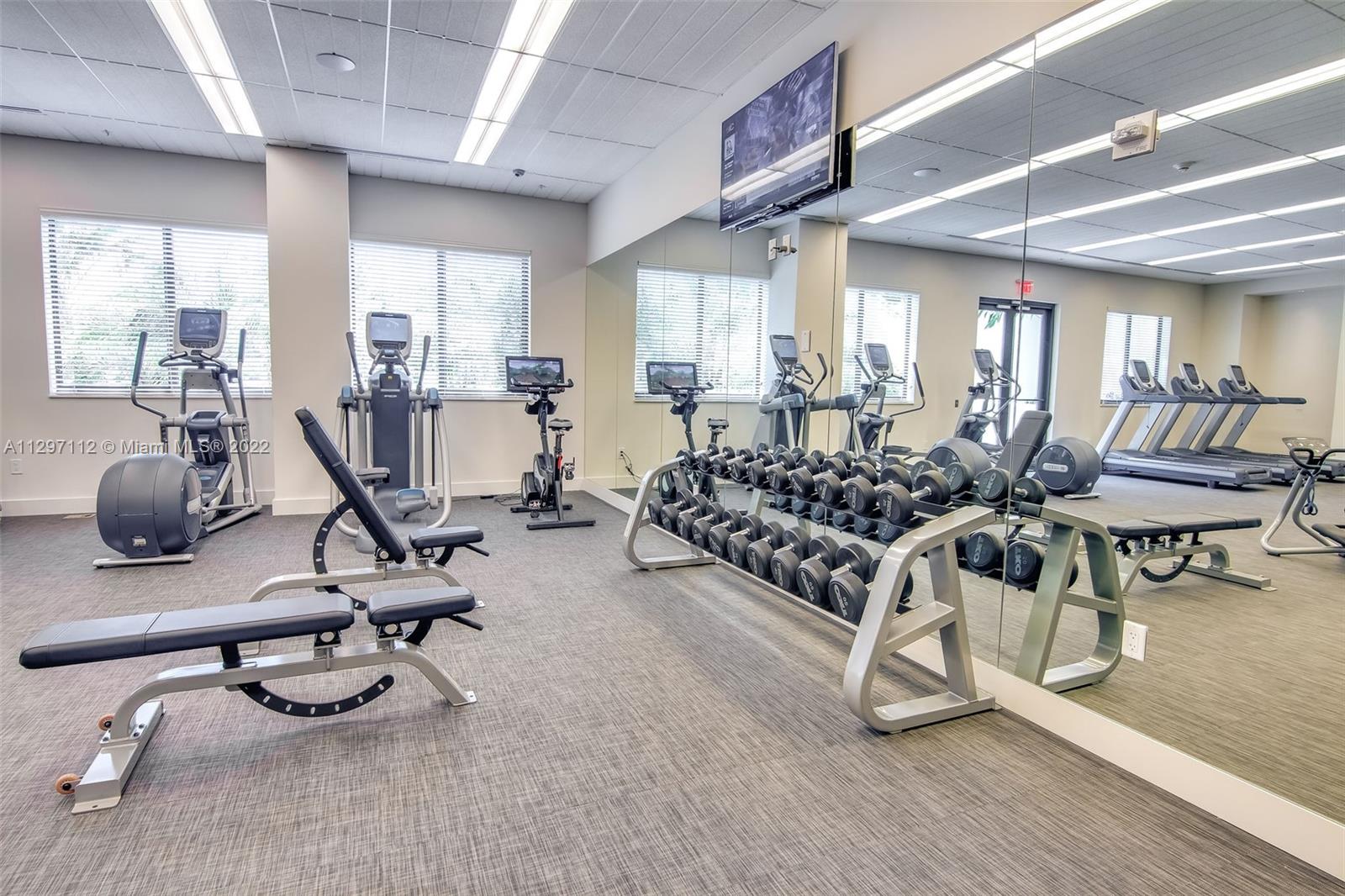 999 Southwest 1st Avenue, Unit 2717 Miami, FL 33130 - Photo 35 of 93 a view of a room with gym equipment