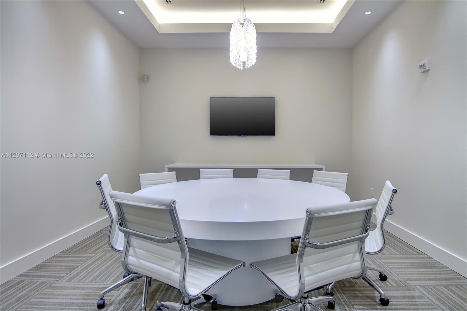999 Southwest 1st Avenue, Unit 2717 Miami, FL 33130 - Photo 39 of 93 a view of a dining room with furniture and wooden floor