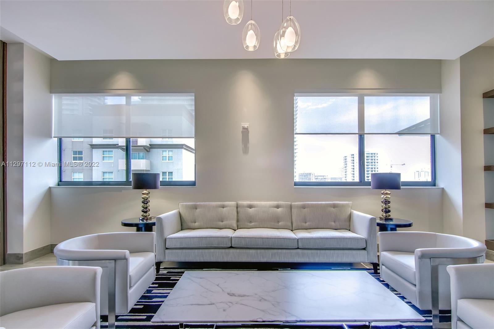 999 Southwest 1st Avenue, Unit 2717 Miami, FL 33130 - Photo 57 of 93 a living room with furniture and a window