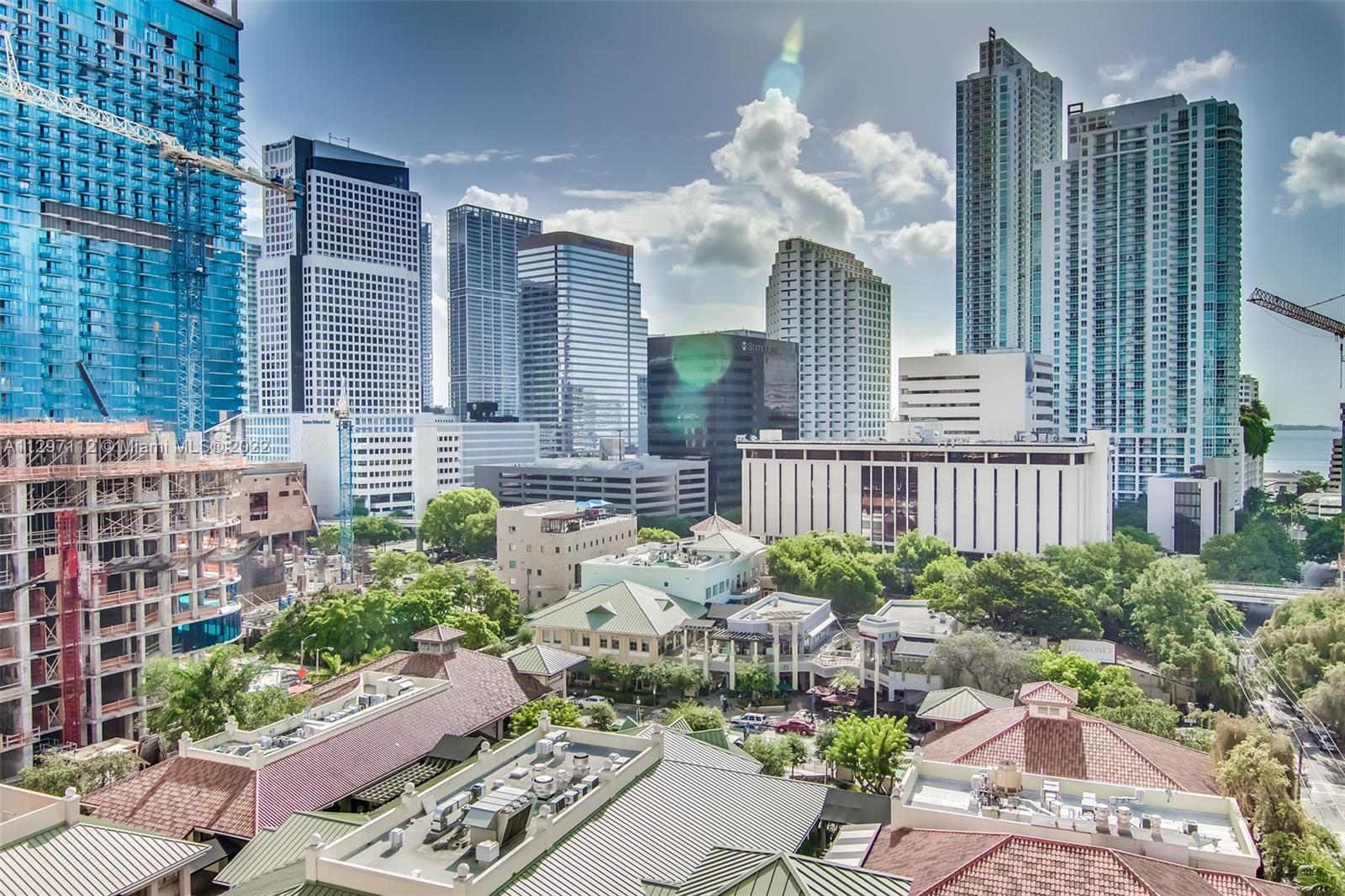 999 Southwest 1st Avenue, Unit 2717 Miami, FL 33130 - Photo 58 of 93 a view of a house with a chairs and flower garden