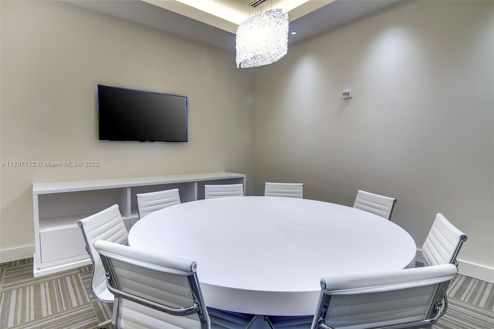 999 Southwest 1st Avenue, Unit 2717 Miami, FL 33130 - Photo 60 of 93 a view of a dining room with furniture