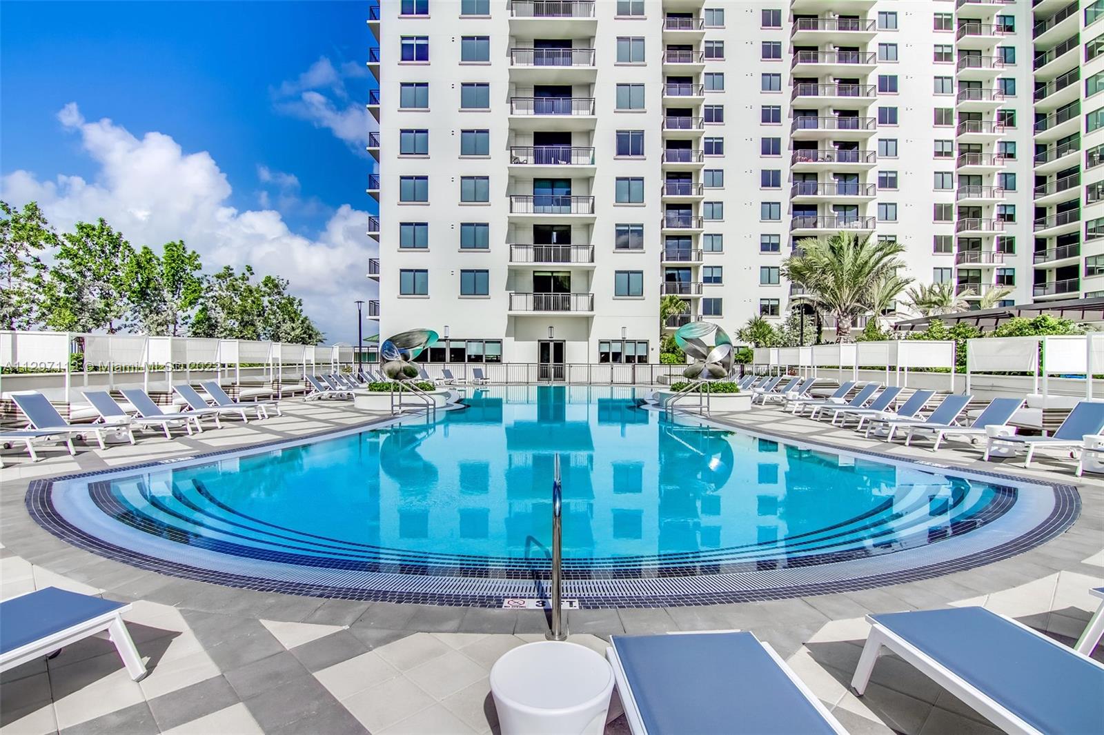 999 Southwest 1st Avenue, Unit 2717 Miami, FL 33130 - Photo 64 of 93 a view of a kitchen with granite countertop a sink and a stove