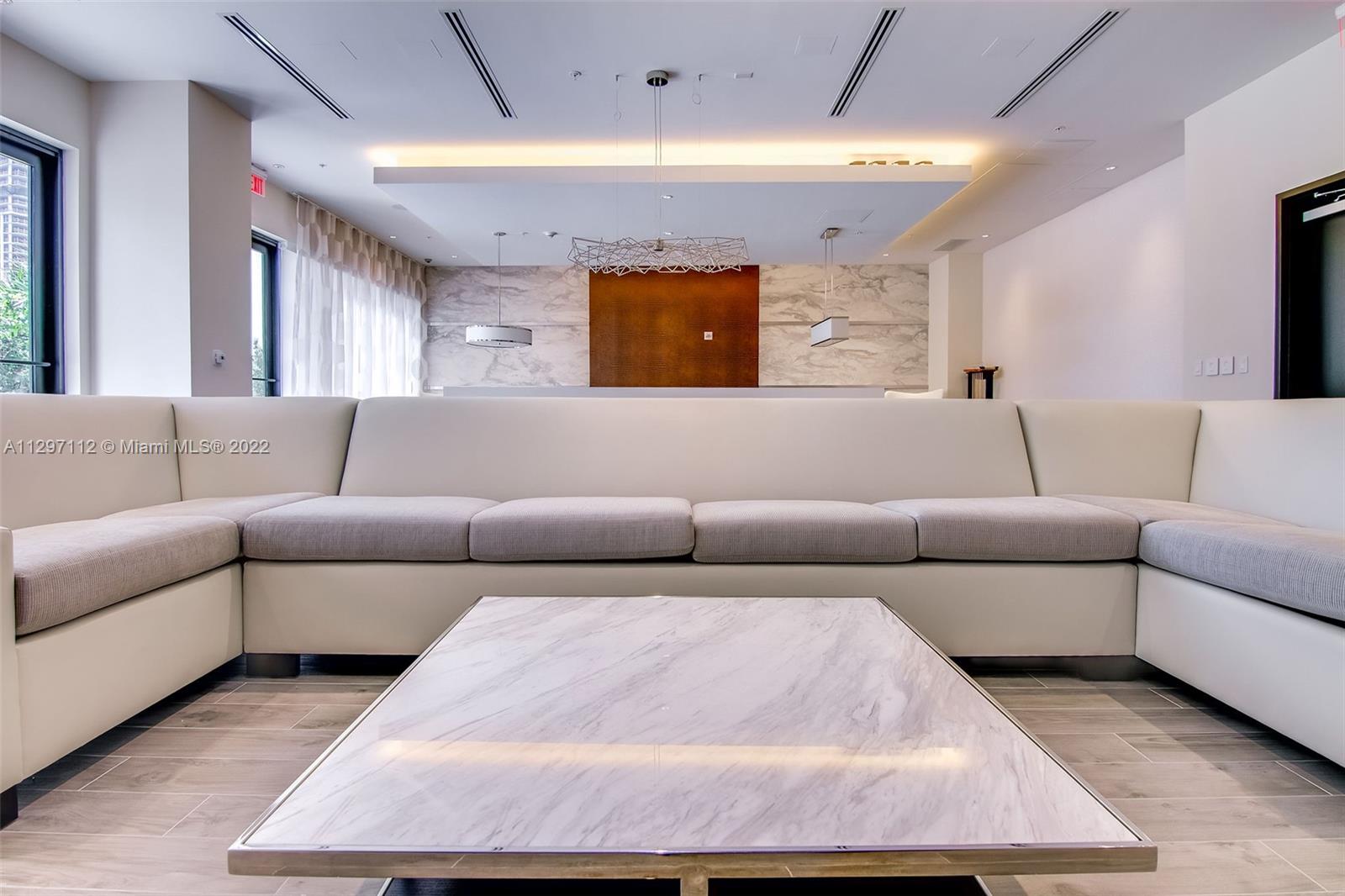 999 Southwest 1st Avenue, Unit 2717 Miami, FL 33130 - Photo 77 of 93 a living room with furniture and a large window