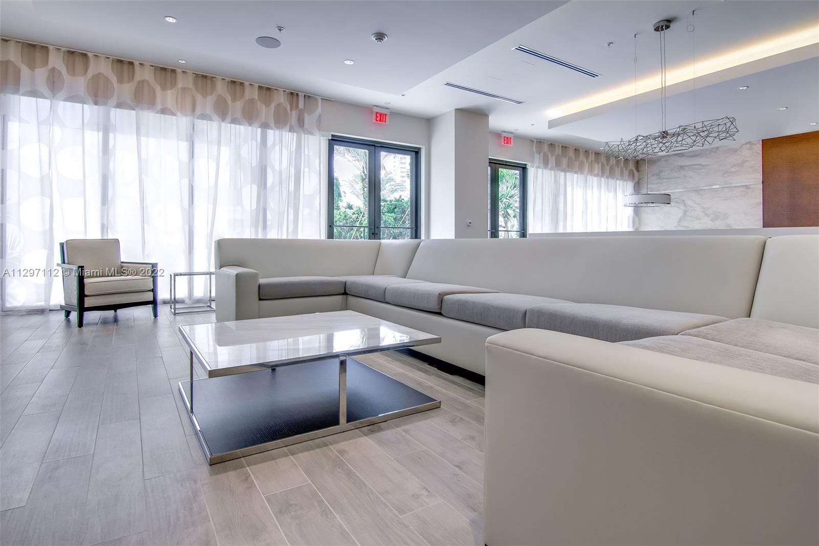 999 Southwest 1st Avenue, Unit 2717 Miami, FL 33130 - Photo 78 of 93 a living room with furniture and a large window