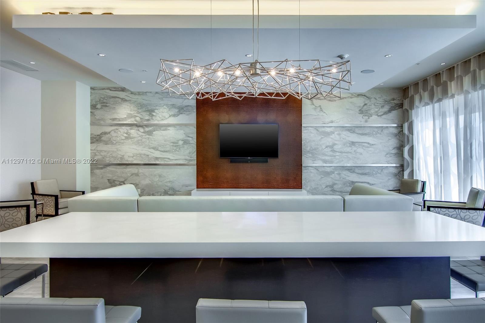 999 Southwest 1st Avenue, Unit 2717 Miami, FL 33130 - Photo 80 of 93 a bathroom with a sink and a large mirror