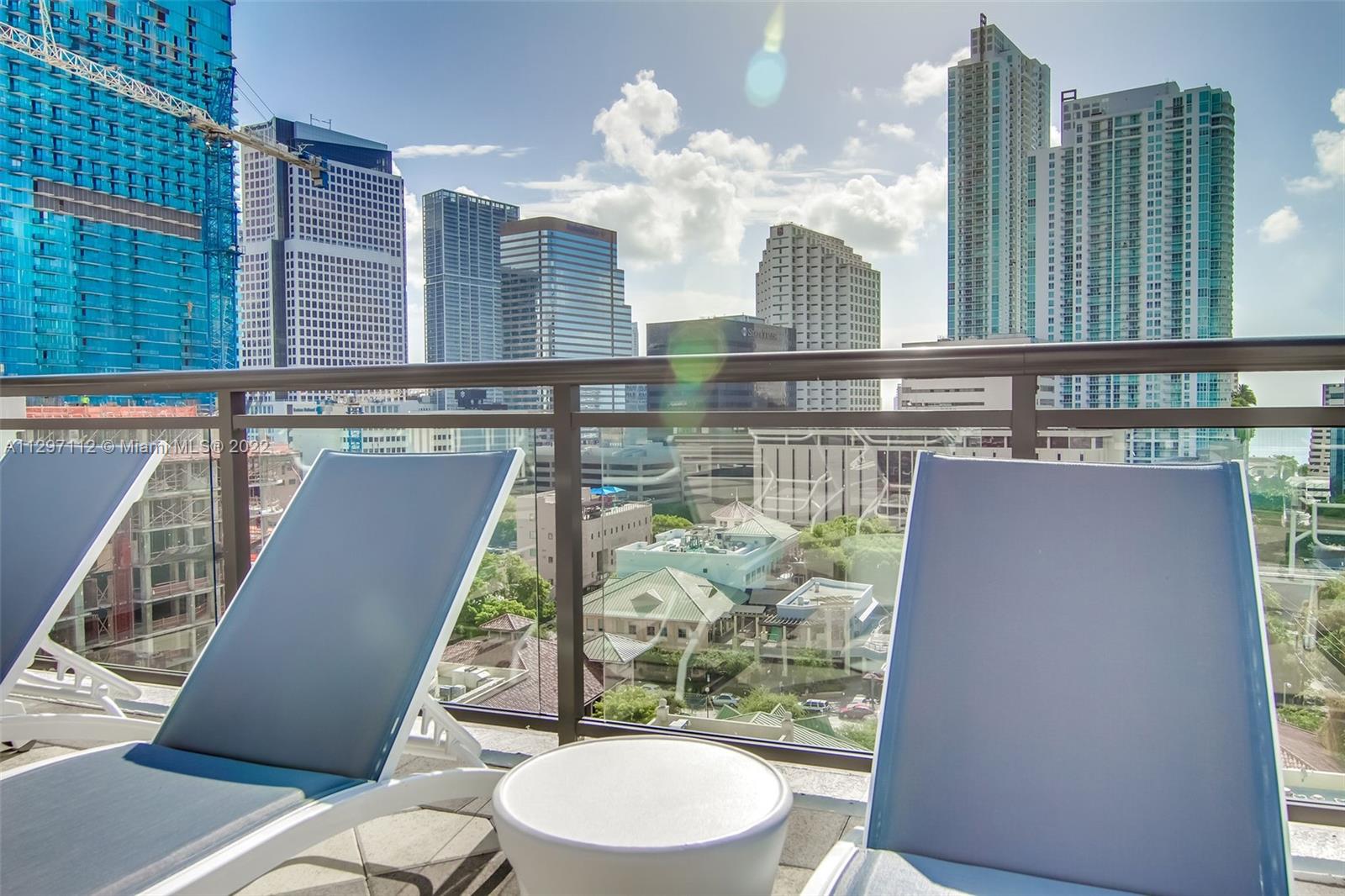999 Southwest 1st Avenue, Unit 2717 Miami, FL 33130 - Photo 82 of 93 a bathroom with a toilet a sink a mirror and bathtub