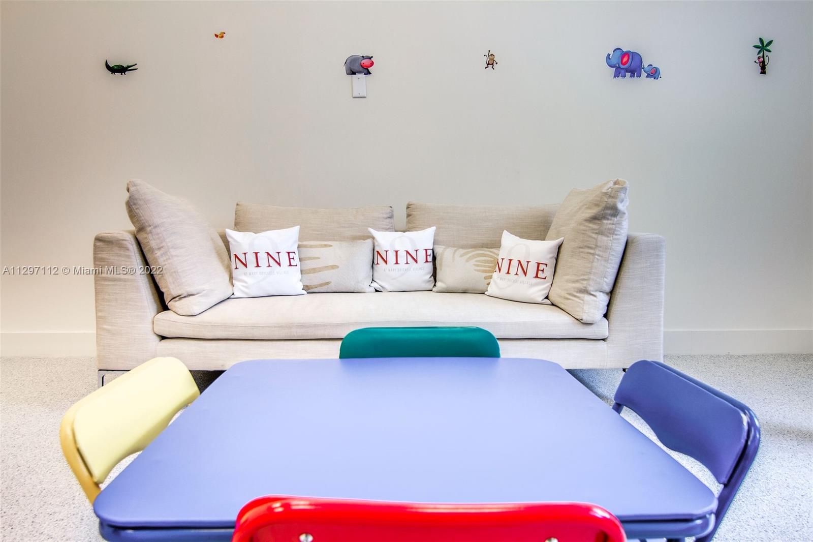 999 Southwest 1st Avenue, Unit 2717 Miami, FL 33130 - Photo 89 of 93 a bedroom with a bed and a chair