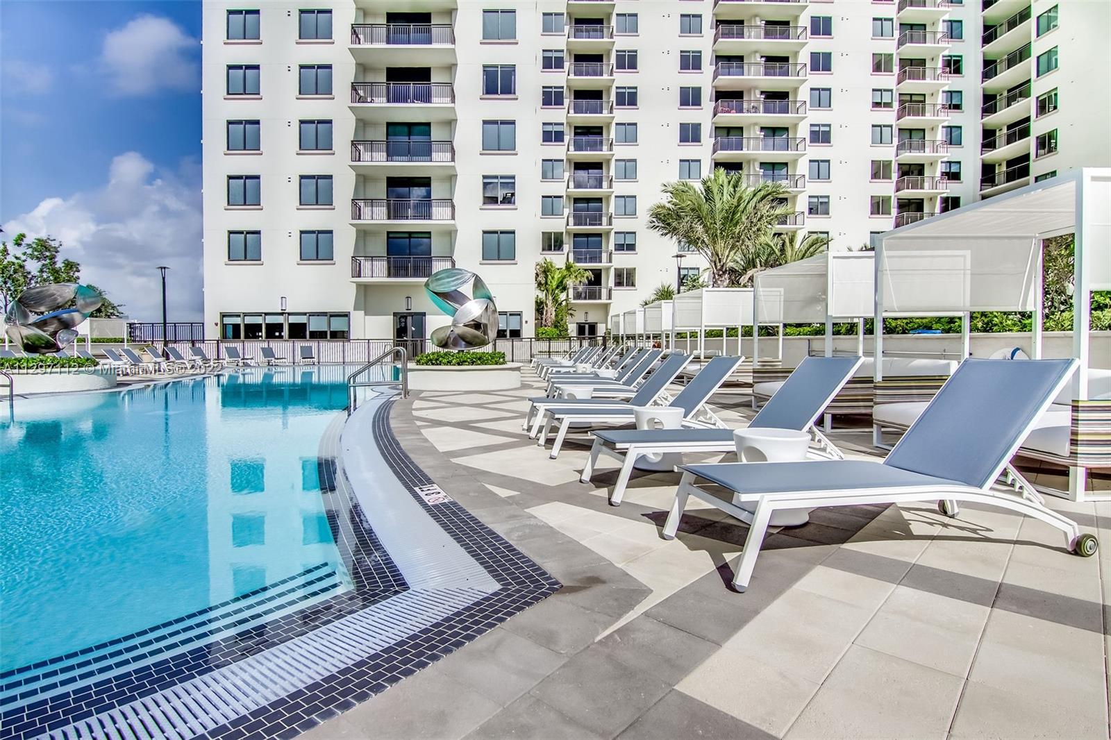 999 Southwest 1st Avenue, Unit 2717 Miami, FL 33130 - Photo 93 of 93 a view of a swimming pool with outdoor seating