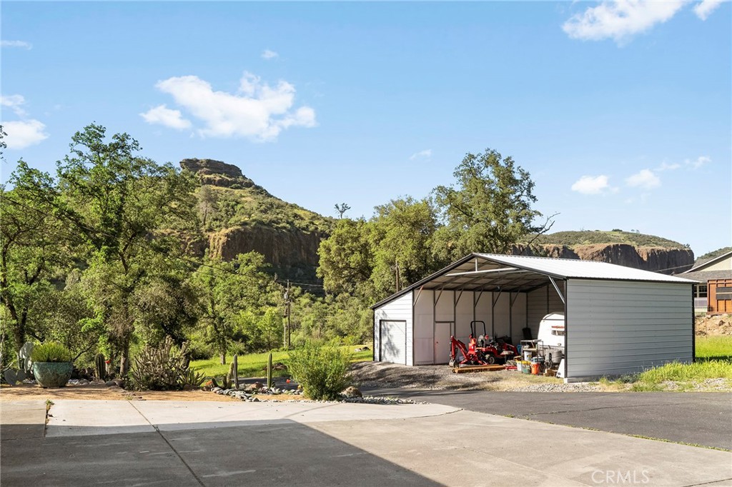2262 Honey Run Road Chico, CA 95928 - Photo 47 of 74 a view of a house with large space and a car parked on the road