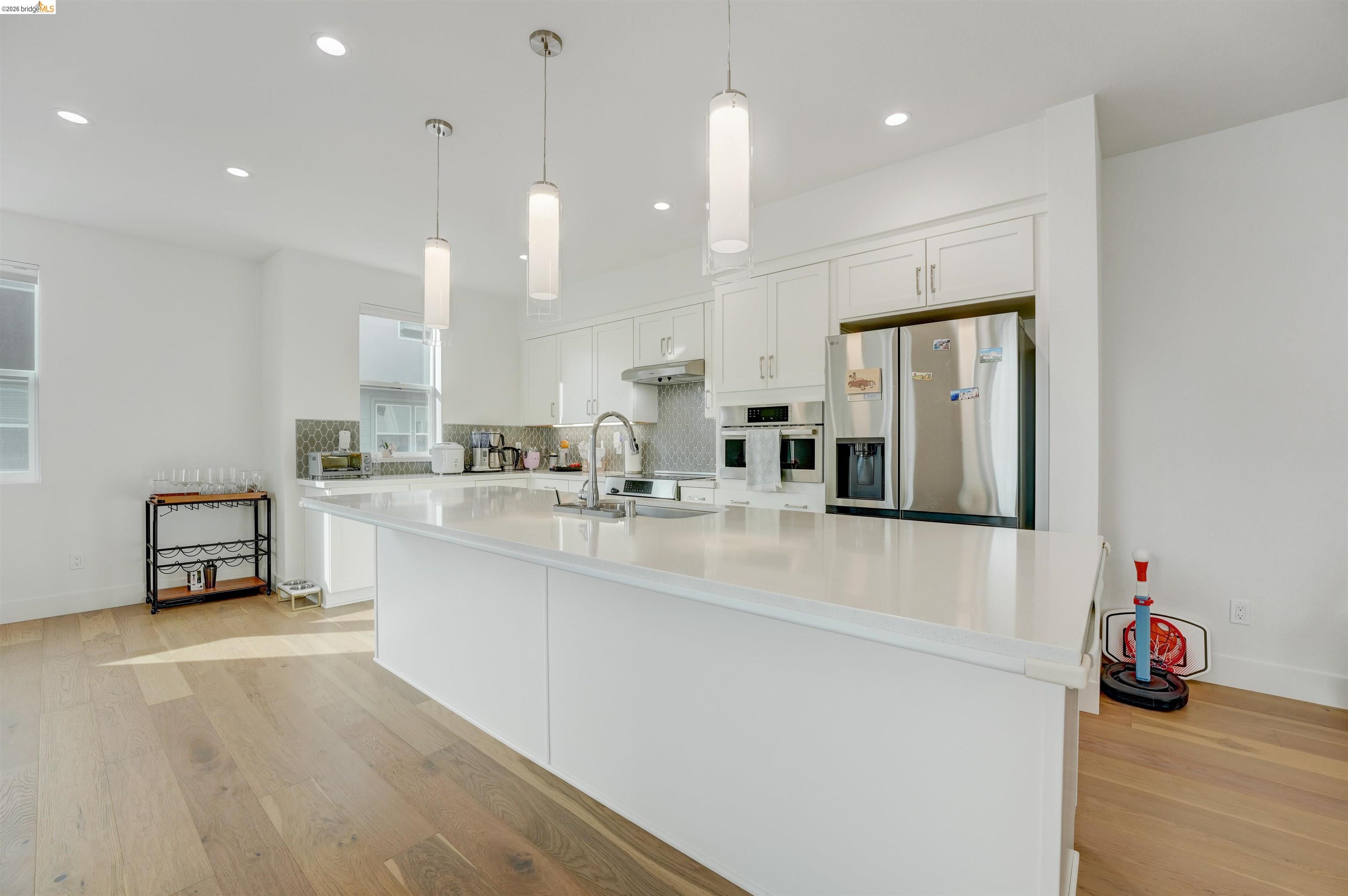 7101 Melon Court San Ramon, CA 94583 - Photo 20 of 58 a kitchen with stainless steel appliances granite countertop a sink a stove and a refrigerator