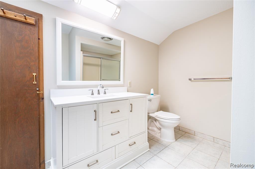 19130 Meridian Road Grosse Ile, MI 48138 - Photo 34 of 49 Large full bathroom upstairs has new vanity and toilet.