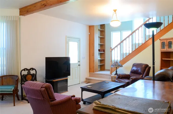 a living room with furniture fireplace and a flat screen tv