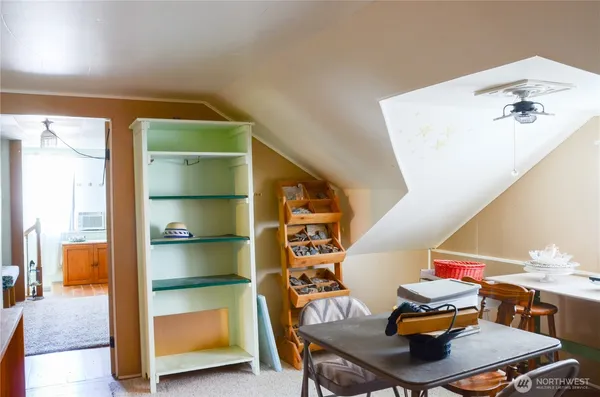a room with furniture and a book shelf