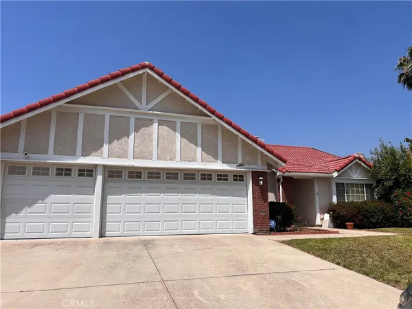 a front view of a house with yard