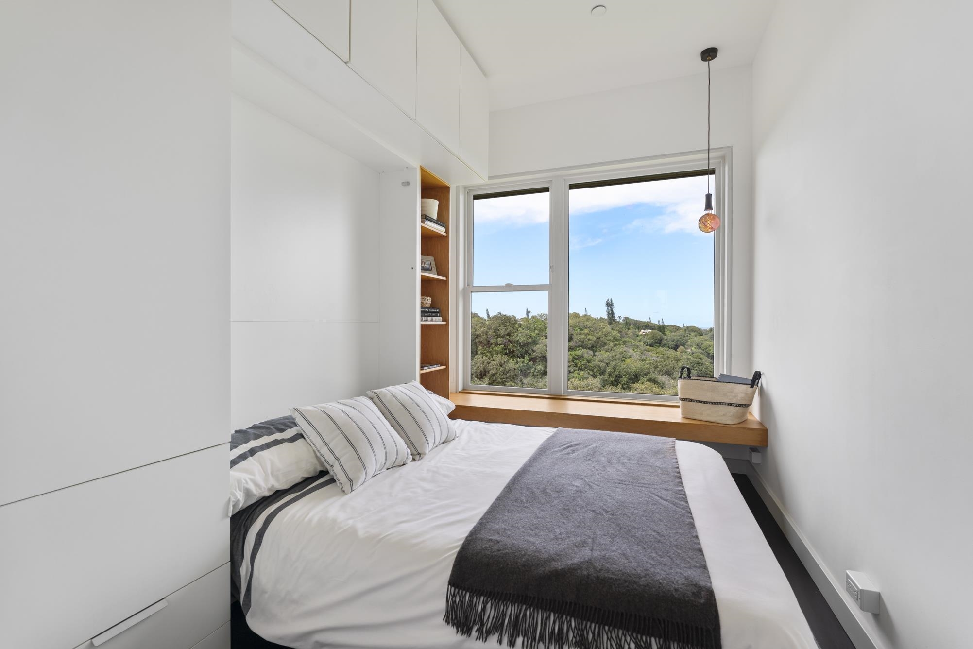 3127 Ua Noe Place, Unit B Haiku, HI 96708 - Photo 19 of 50 a bedroom with a large bed and a large window