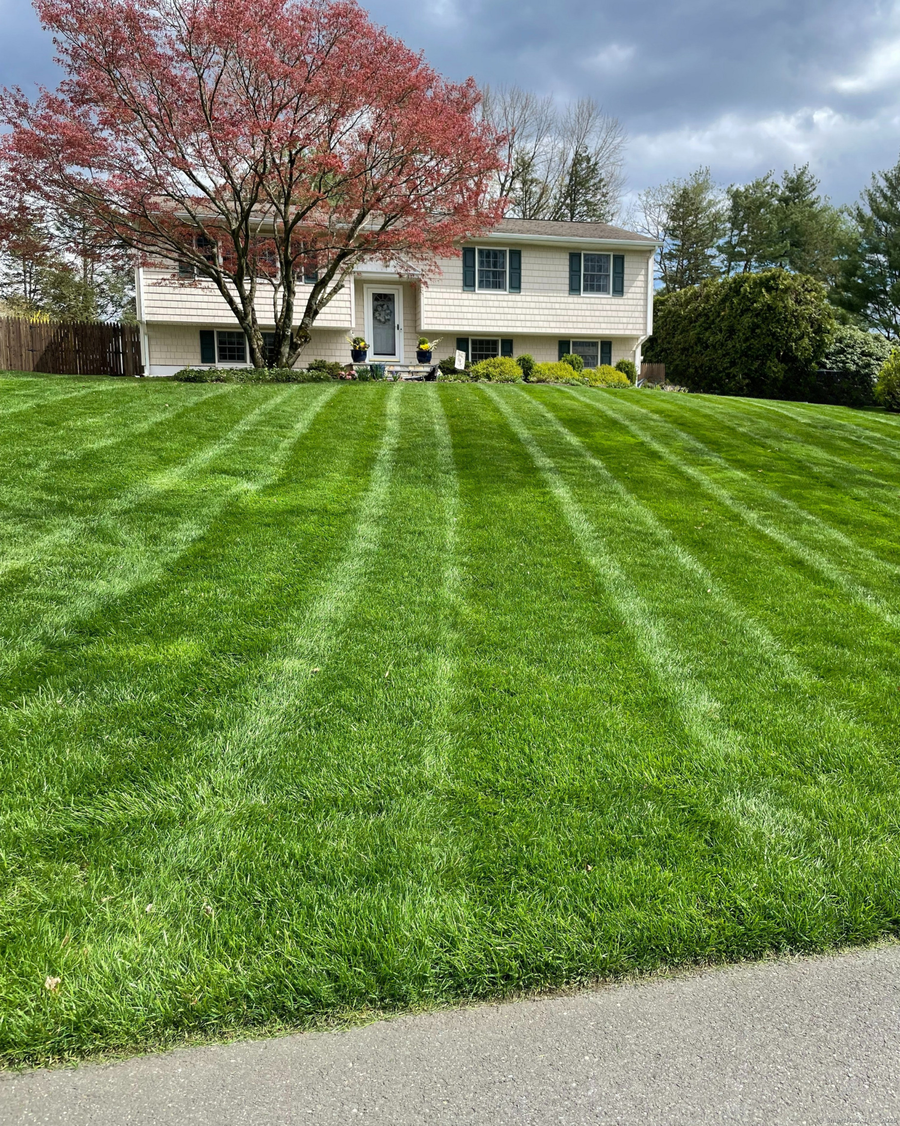 a front view of a house with a yard