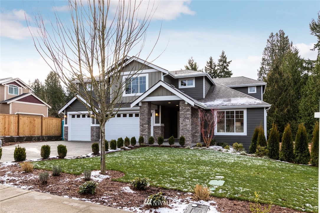 6515 Southeast 2nd Place Renton, WA 98059 - Photo 1 of 29 a front view of a house with a garden