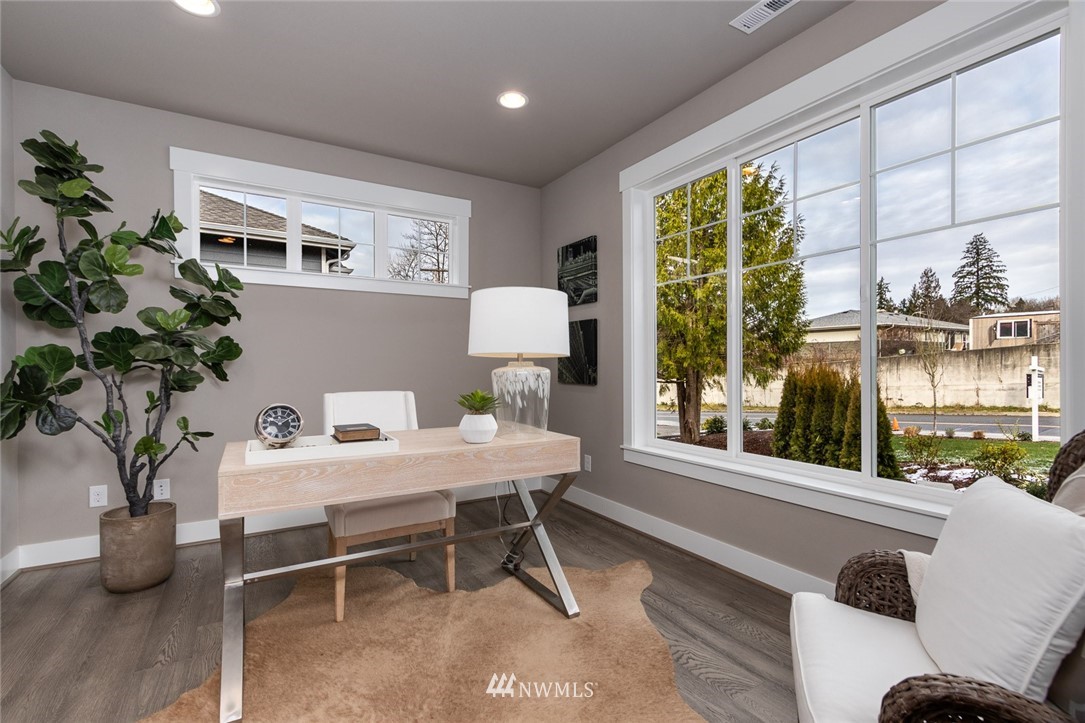 6515 Southeast 2nd Place Renton, WA 98059 - Photo 3 of 29 a view of a dining room with furniture window and wooden floor