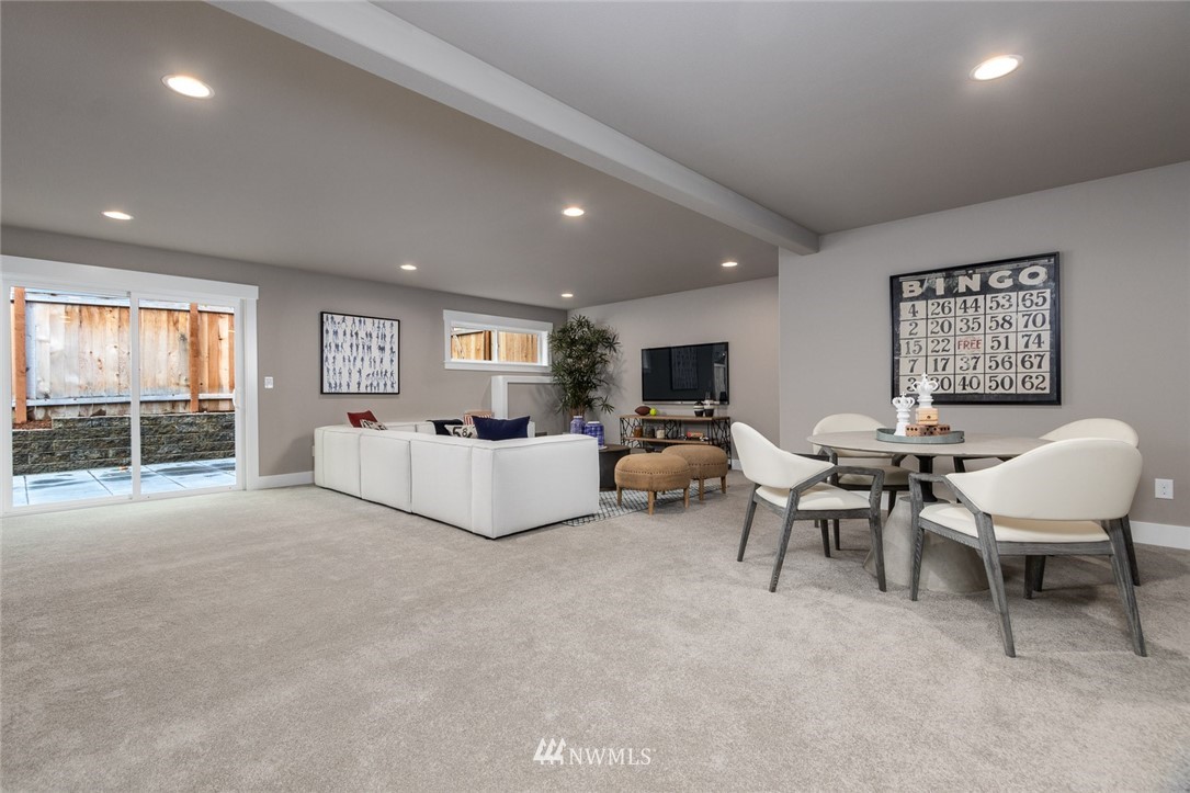 6515 Southeast 2nd Place Renton, WA 98059 - Photo 22 of 29 a living room with furniture and a flat screen tv