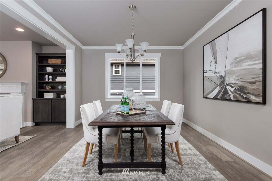 6515 Southeast 2nd Place Renton, WA 98059 - Photo 4 of 29 a view of a dining room with furniture window and wooden floor