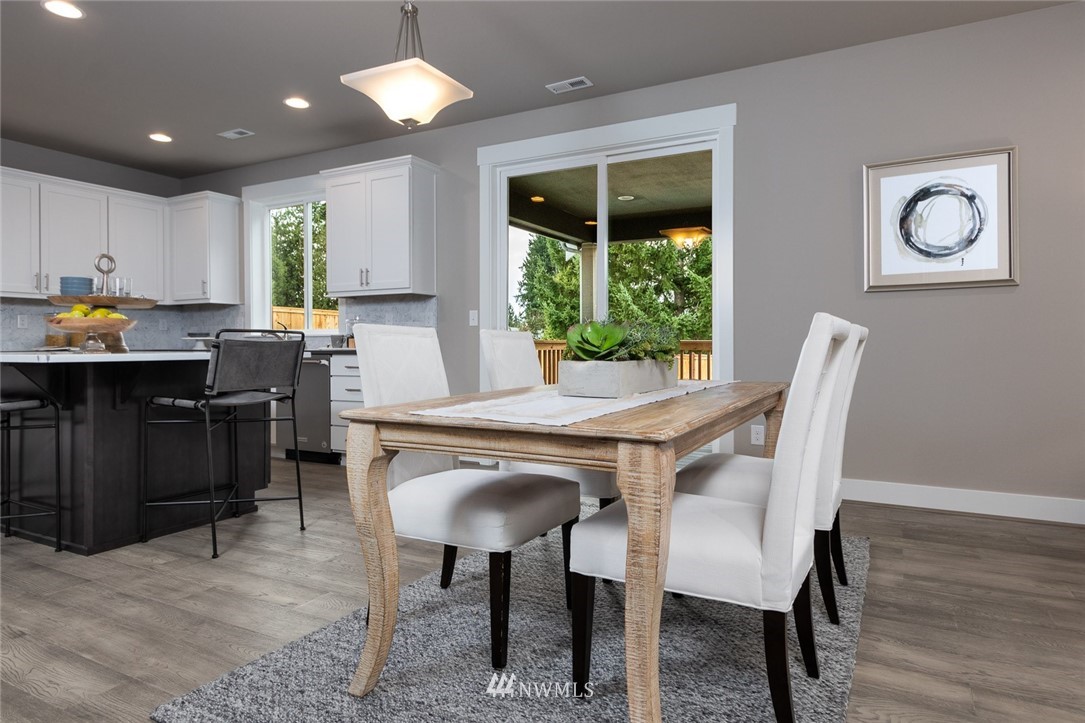 6515 Southeast 2nd Place Renton, WA 98059 - Photo 5 of 29 a view of a dining room with furniture window and wooden floor