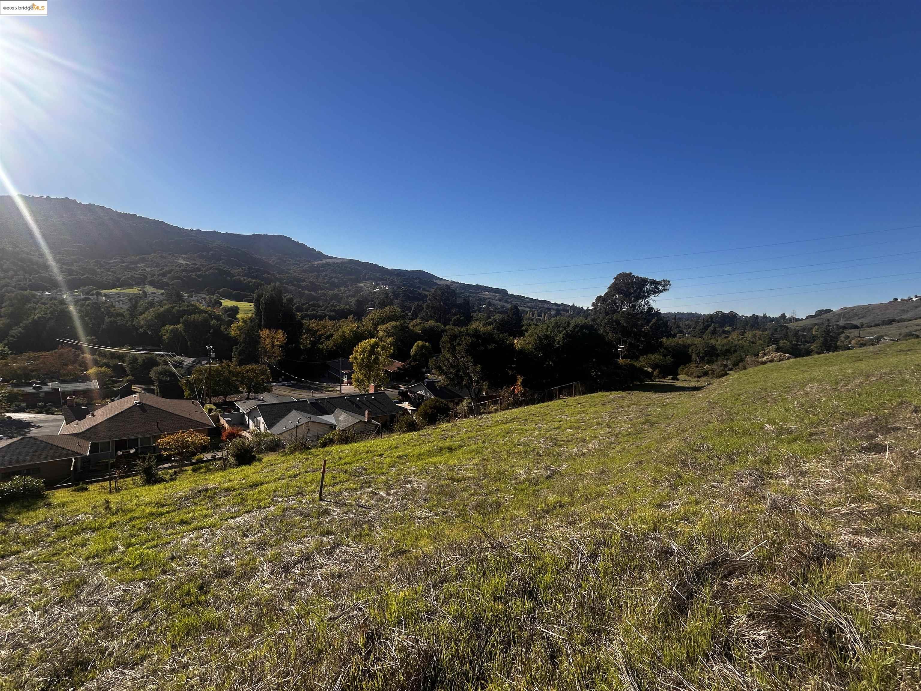 7 Abbey Lane El Sobrante, CA 94803 - Photo 3 of 13 a view of a lake with a mountain in the background